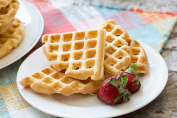 a stack of plain round waffles