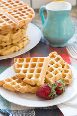 a stack of plain round waffles