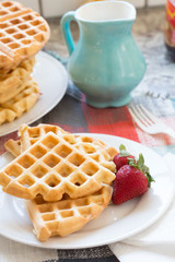 a stack of plain round waffles