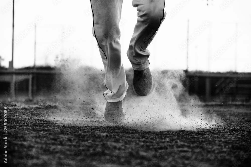 Canvas Prints Black and white baseball concept with player running on dirt field close up. - Canvas Prints