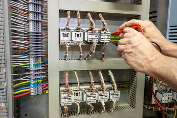 Electrical engineer testing a contactor