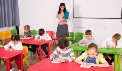 Fototapeta na wymiar School kids studying in classroom