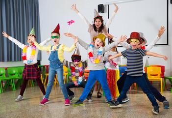 Pupils and teacher with festive accessories posing together