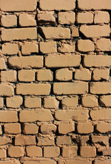 Brick wall old weathered brown stone texture background. Grunge abstract brick stones pattern, dirty rough painted wall front 