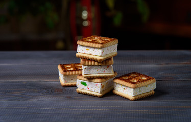 Cookies with marshmallows and marmalade on a wooden table. Fresh homemade pastries.
