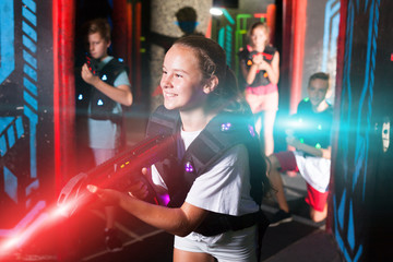 Girl playing laser tag