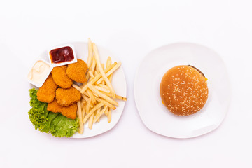 Concept of mock up burger, french fries and fried chicken set isolated on white background. Copy space for text and logo. Clipping Path included on white background.
