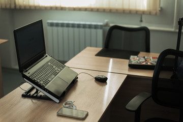 phone and laptop in the office. office worker and manager workspace