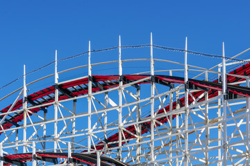 Old wood vintage roller coaster, amusement park.