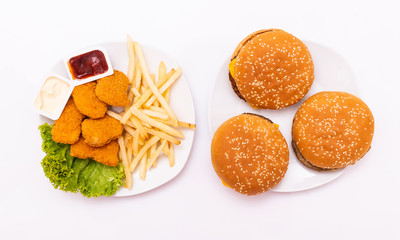 Concept of mock up burger, french fries and fried chicken and soda set isolated on white background. Clipping Path included on white background.