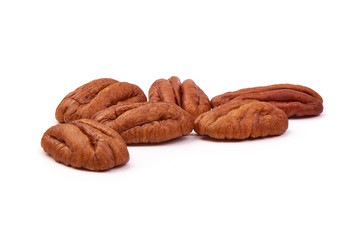 Pecan nuts halves, close-up, isolated on white background