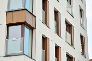 Fragment of a modern apartment building in front. Very modern apartment house.