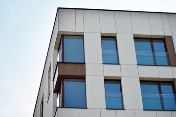 Obraz premium Fragment of a modern apartment building in front. Very modern apartment house.