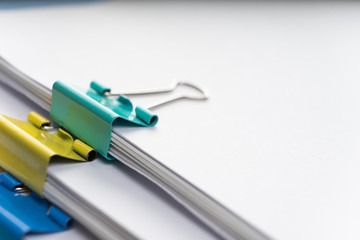 Mock up, stack of papers documents in archives files with paper clips on desk at offices, business concept. Copy space.