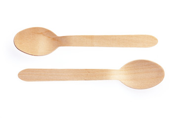 Eco-friendly materials. Wooden, disposable spoon on a white background.