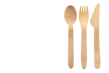 Eco-friendly materials. Wooden, disposable tableware on a white background.