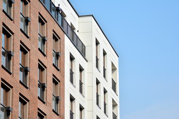 Obraz premium Fragment of a modern apartment building in front. Very modern apartment house.