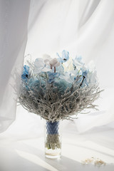 Bridal bouquet in blue white colors, closeup flowers.