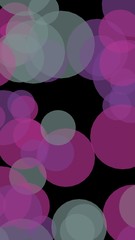 Multicolored translucent circles on a dark background. 3D 