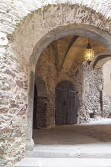 Fototapeta na wymiar Antique medieval stone arch inside the castle