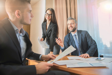Office teamwork situation. Group of people and daily general tasks in   workspace 