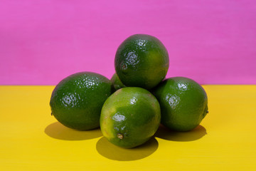 Set of limes on colorful background