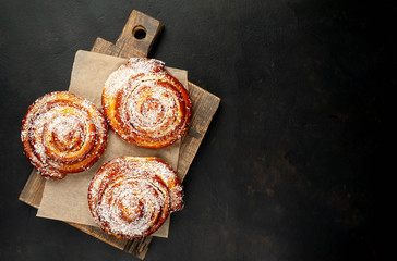 buns with pineapple filling on a cutting board on a background of concrete,Kanelbule - swedish...