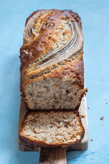 Sliced banana bread loaf with a walnuts