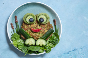 Healthy oatmeal banana spinach pancake look like a frog
