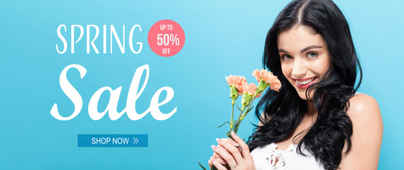 Spring sale message with young woman holding carnation flowers