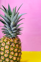 Raw pineapple on colorful background