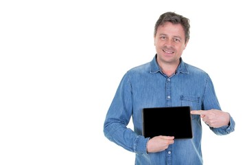 man isolated on white background in blue shirt holding tablet and showing it black screen with happy smile as if advising product or application