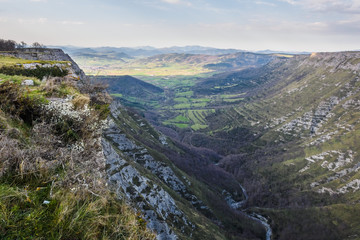 Obraz premium Nervión River canyon and the Nervión waterfall on a sunny day. Border in the Basque Country and Castilla y Leon