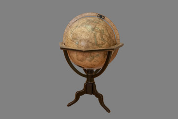 Isolated - old wooden globe on a gray background.