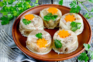 Aspic meat jelly kholodets with carrot and parsley