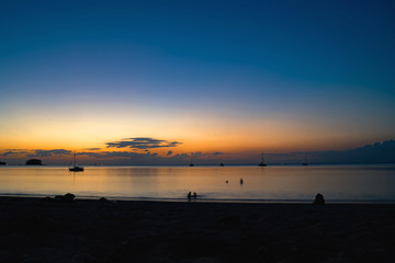 Background sky sunset,Silhouette Thai boat love travel to the beach adventure,Bright in Phuket Thailand.