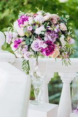 Wedding bouquet on the background of the bride and groom