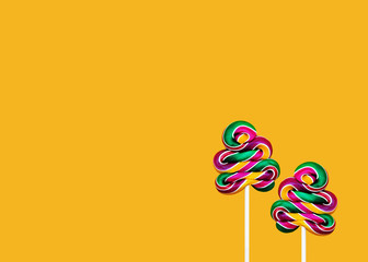 Sweet lollipops Minimal concept Two swirl candy lollipops on an orange background Template with...
