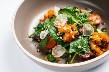 salad with spinach and roasted pumpkin