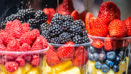 Colorful different fruit sets at street cafe, outdoor
