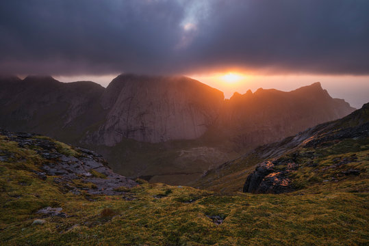 Evening sun breaks though clouds over mountains from the summit of Markan (602m), Moskenes&oslash;y, Lofoten Islands, Norway