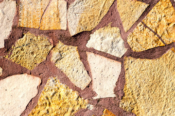 Fototapeta premium The background old beige stony wall
