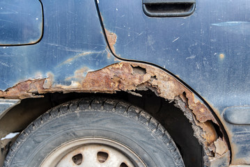 Close-up Detail of a rusty Car blue vintage Car