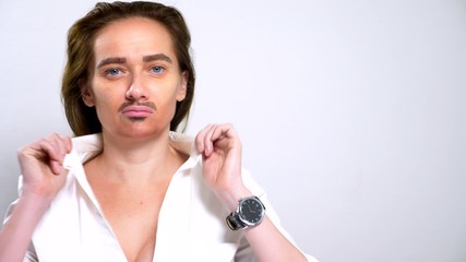 portrait of androgynous feminists with a painted mustache on her face.