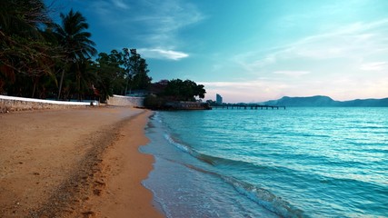 The concept of rest. beautiful tropical beach, calm blue waves at sunset