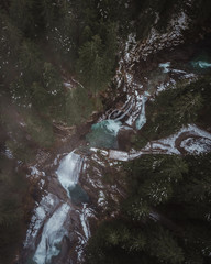Aerial view at winter Krimml Waterfalls/Krimmler Wasserfälle  in Austrian Alps with cloudy weather.