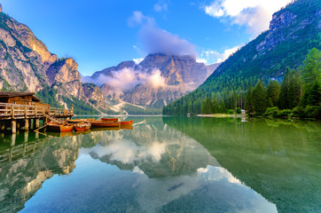 Spectacular romantic place with typical wooden boats on the alpine lake,(Lago di Braies) Braies...