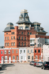 Row houses and the American Brewery Building, in Baltimore, Maryland