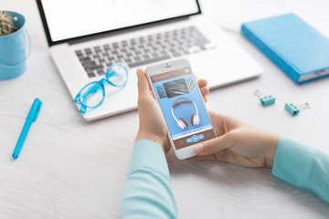 Man holds a tablet and looks at the screen. Mobile development. Innovational online businesses. Internet technologies. Trendy design. Geometry. Fashionable vibrant colors. Using a device. UX and UI.