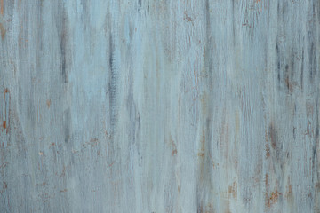 Fototapeta na wymiar Light grey-bluish wooden texture with crackled paint. Aged grunge surface, copy-space